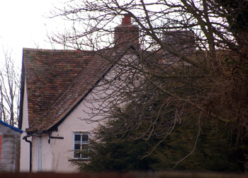 A glimpse of Bridge Farmhouse from the road March 2010